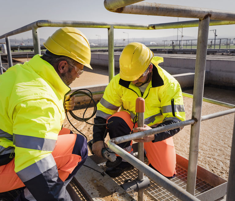 Team Members Check Water